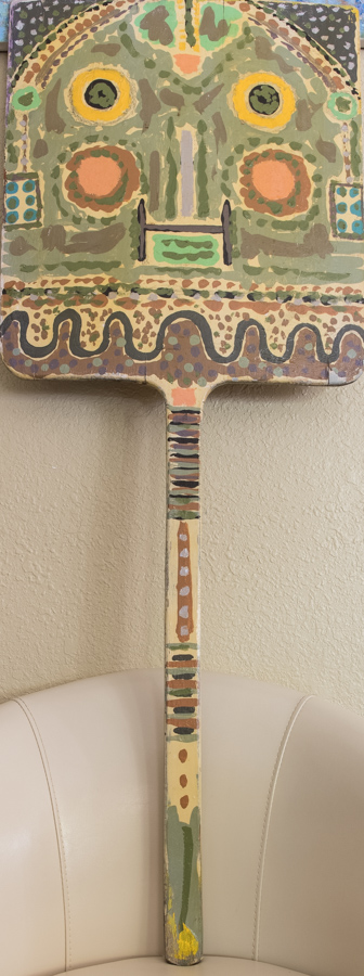 Pizza Paddle  is an original wood-painted sculpture measuring 42 × 16 inches, completed in 1990 by American Expressionist Landscape painter Bud Holman.